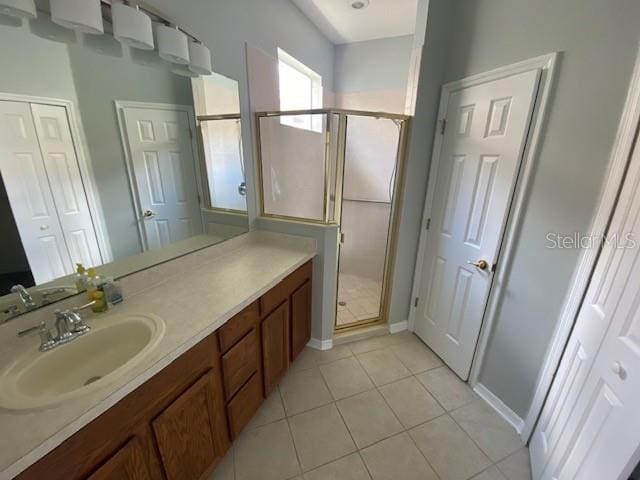 9048 Saint Andrews Way, Mount Dora, FL 32757 - bathroom with a stall shower, vanity, and tile patterned floors