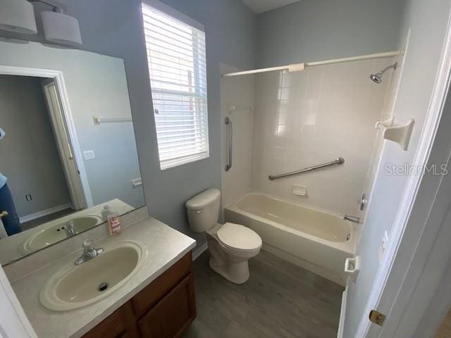 9048 Saint Andrews Way, Mount Dora, FL 32757 - bathroom with vanity,  shower combination, and wood finished floors