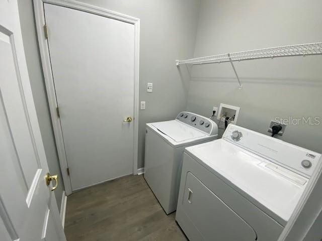 9048 Saint Andrews Way, Mount Dora, FL 32757 - laundry room featuring separate washer and dryer and light wood-style flooring