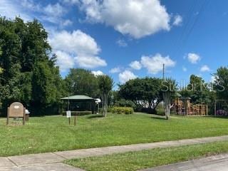 9048 Saint Andrews Way, Mount Dora, FL 32757 - surrounding community with a lawn and a gazebo
