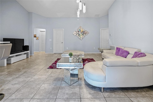 211 Foxtail Loop, Davenport, FL 33837 - tiled living room featuring baseboards