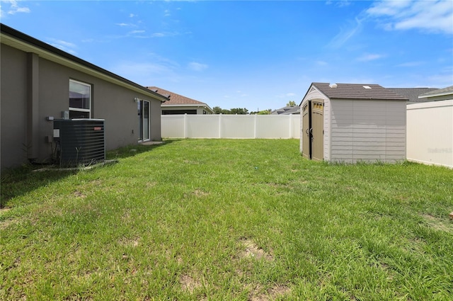 211 Foxtail Loop, Davenport, FL 33837 - fenced backyard featuring a storage shed