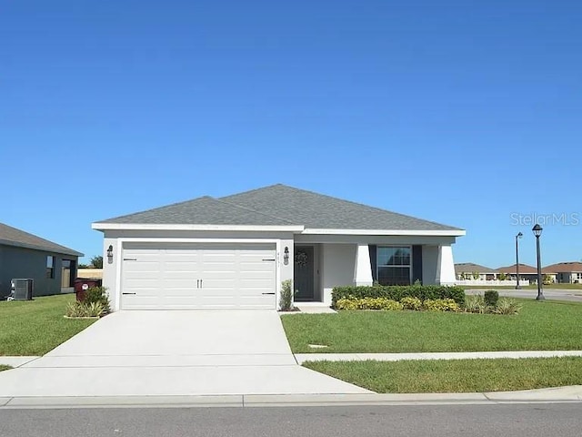 4651 Calumet Dr, Saint Cloud, FL 34772 - ranch-style house featuring a garage, a front yard, driveway, and stucco siding