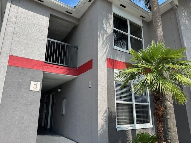 3100 Parkway Blvd Unit 316, Kissimmee, FL 34747 - view of side of home featuring stucco siding