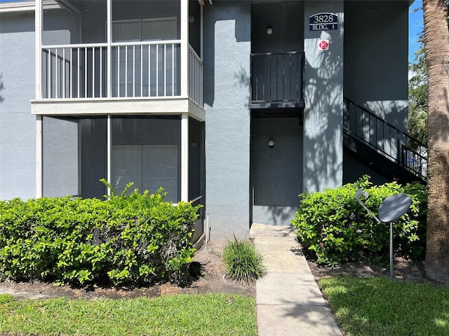 3828 Bowline Cir Unit 101, Kissimmee, FL 34741 - doorway to property with stucco siding