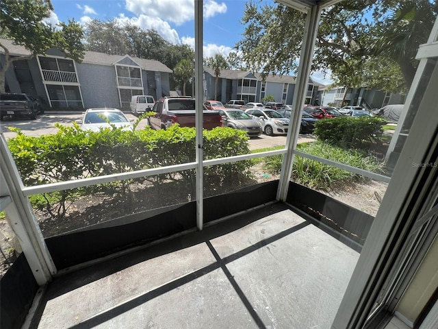 3828 Bowline Cir Unit 101, Kissimmee, FL 34741 - sunroom / solarium featuring a residential view