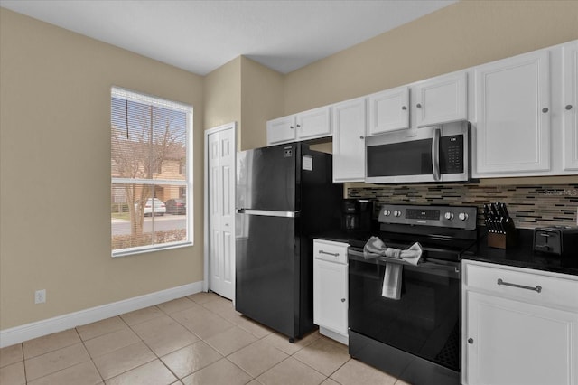 2234 Calabria Ave, Davenport, FL 33897 - kitchen featuring black appliances, dark countertops, white cabinets, and tasteful backsplash