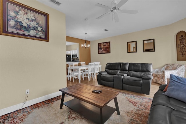 2234 Calabria Ave, Davenport, FL 33897 - living room with a chandelier and a ceiling fan