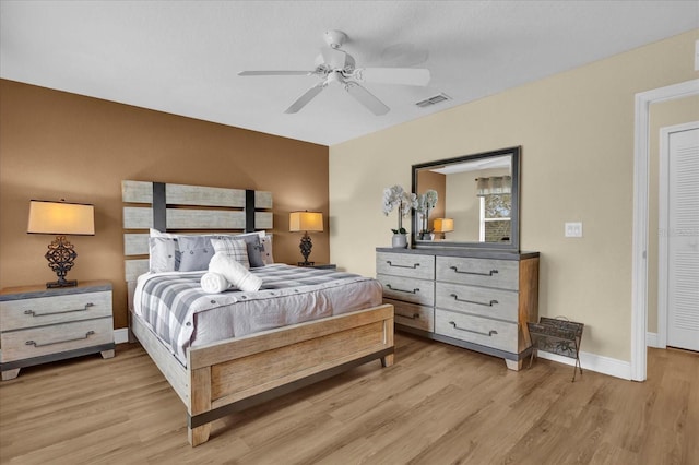 2234 Calabria Ave, Davenport, FL 33897 - bedroom with light wood finished floors and ceiling fan