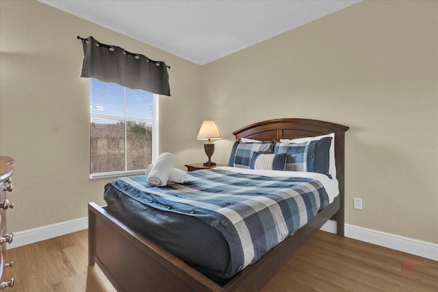 2234 Calabria Ave, Davenport, FL 33897 - bedroom featuring wood finished floors and baseboards