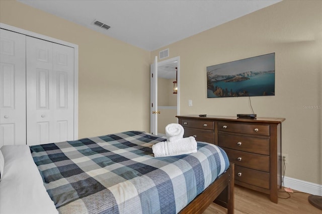 2234 Calabria Ave, Davenport, FL 33897 - bedroom featuring light wood-type flooring and a closet