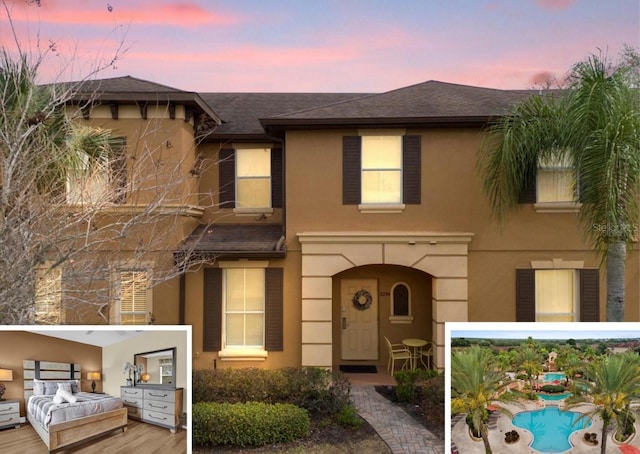 2234 Calabria Ave, Davenport, FL 33897 - view of front facade with stucco siding and a shingled roof