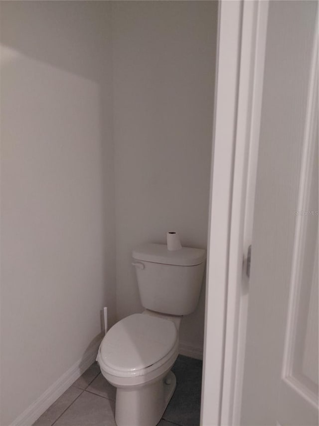 2132 Desert Rose Dr, Davenport, FL 33837 - bathroom featuring toilet and tile patterned floors