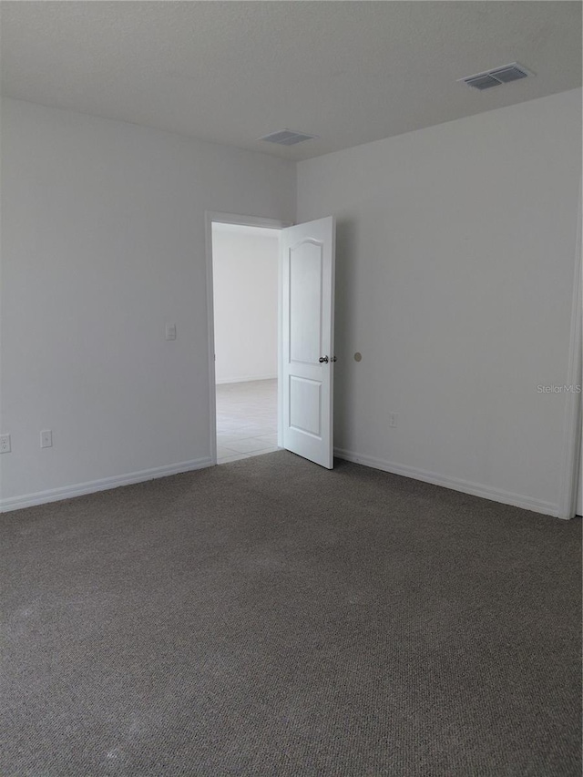 2132 Desert Rose Dr, Davenport, FL 33837 - carpeted spare room featuring baseboards