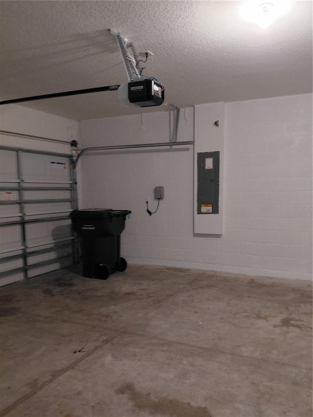 2132 Desert Rose Dr, Davenport, FL 33837 - garage with electric panel, a garage door opener, and concrete block wall