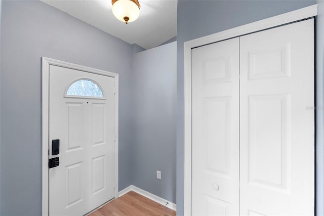 2126 Wekiva Reserve Blvd, Apopka, FL 32703 - foyer entrance with light wood finished floors and a textured ceiling