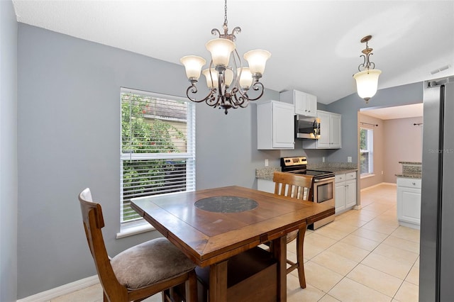 2126 Wekiva Reserve Blvd, Apopka, FL 32703 - dining space with a chandelier and light tile patterned floors