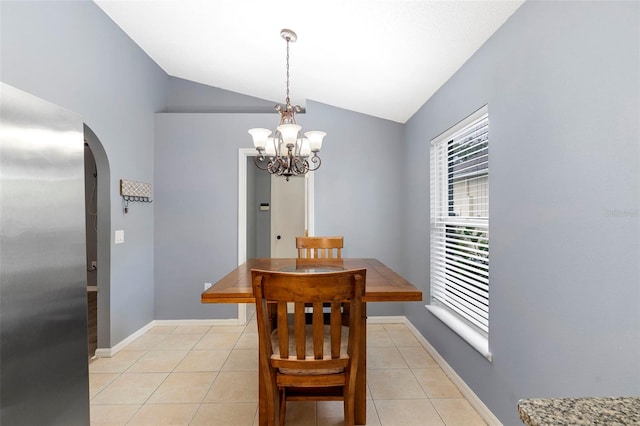 2126 Wekiva Reserve Blvd, Apopka, FL 32703 - dining area with arched walkways, vaulted ceiling, a chandelier, and light tile patterned floors