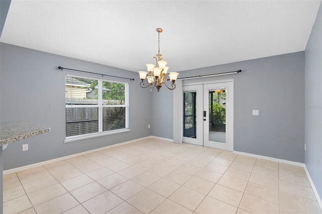 2126 Wekiva Reserve Blvd, Apopka, FL 32703 - unfurnished room with a chandelier, french doors, and light tile patterned floors