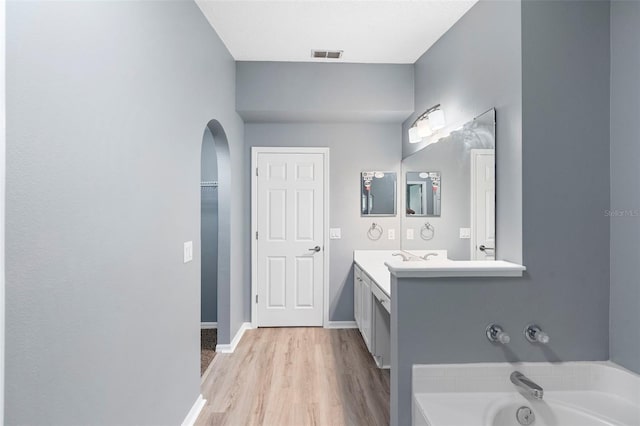 2126 Wekiva Reserve Blvd, Apopka, FL 32703 - full bath featuring vanity, a bath, and wood finished floors