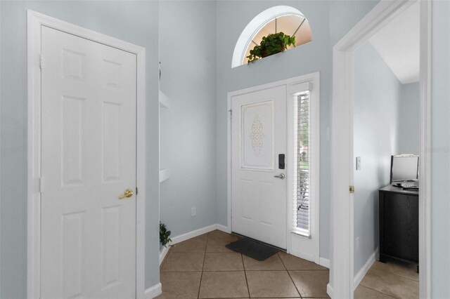 242 Saragossa Ave, Davenport, FL 33897 - tiled entrance foyer featuring baseboards