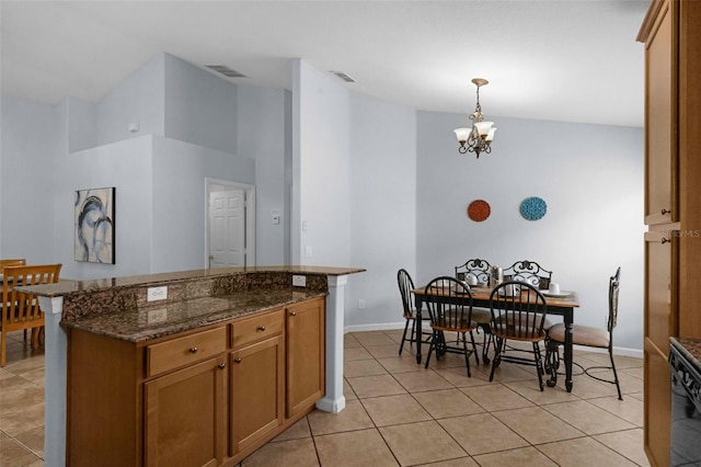 242 Saragossa Ave, Davenport, FL 33897 - kitchen featuring high vaulted ceiling, light tile patterned flooring, a chandelier, pendant lighting, and a kitchen island