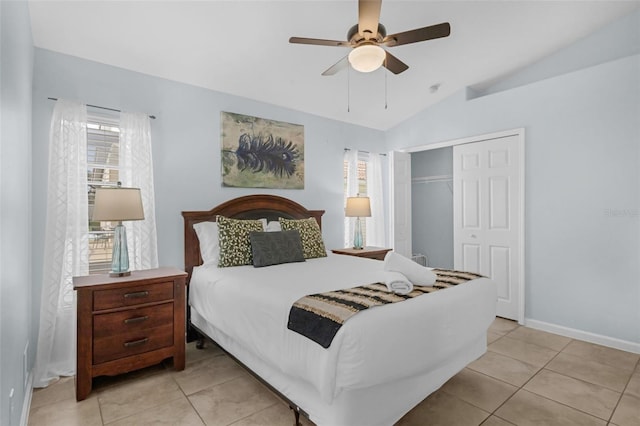 242 Saragossa Ave, Davenport, FL 33897 - bedroom featuring a closet, light tile patterned floors, lofted ceiling, and ceiling fan