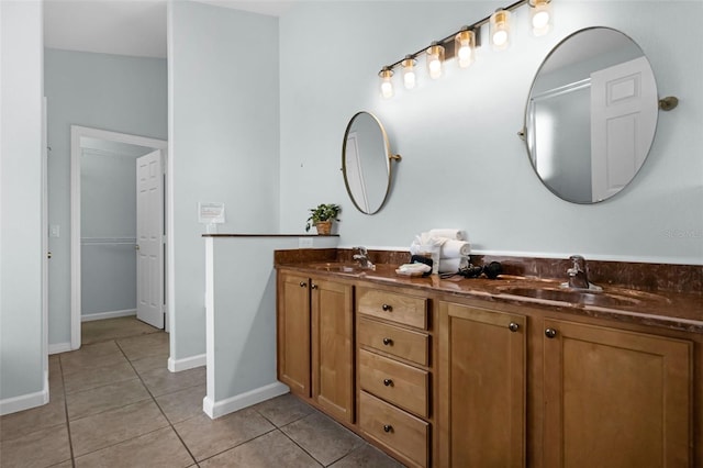 242 Saragossa Ave, Davenport, FL 33897 - bathroom featuring tile patterned flooring, double vanity, and a closet
