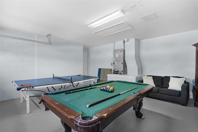 242 Saragossa Ave, Davenport, FL 33897 - rec room with concrete flooring, attic access, heating unit, and billiards