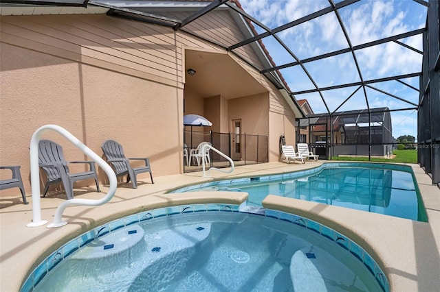 242 Saragossa Ave, Davenport, FL 33897 - view of pool with a patio, a pool with connected hot tub, and glass enclosure