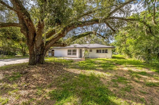 4212 Harry Dr, Fruitland Park, FL 34731 - view of front of property featuring stucco siding and a front yard