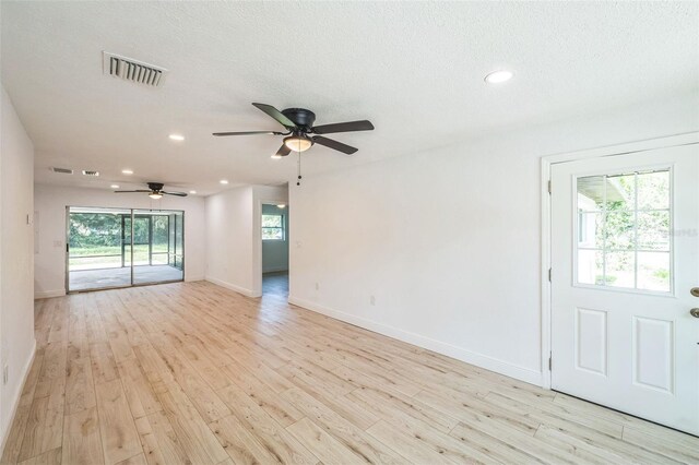 4212 Harry Dr, Fruitland Park, FL 34731 - spare room featuring light wood-type flooring, ceiling fan, recessed lighting, and a textured ceiling