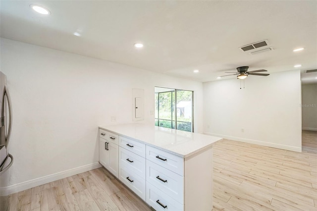 4212 Harry Dr, Fruitland Park, FL 34731 - kitchen featuring a peninsula, light wood-style flooring, white cabinetry, ceiling fan, and recessed lighting