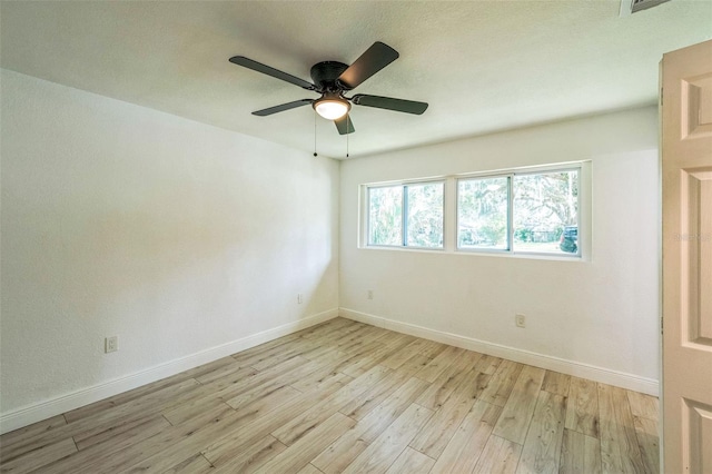 4212 Harry Dr, Fruitland Park, FL 34731 - unfurnished room with light wood finished floors and ceiling fan