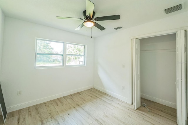 4212 Harry Dr, Fruitland Park, FL 34731 - unfurnished bedroom featuring light wood-type flooring, a closet, and ceiling fan