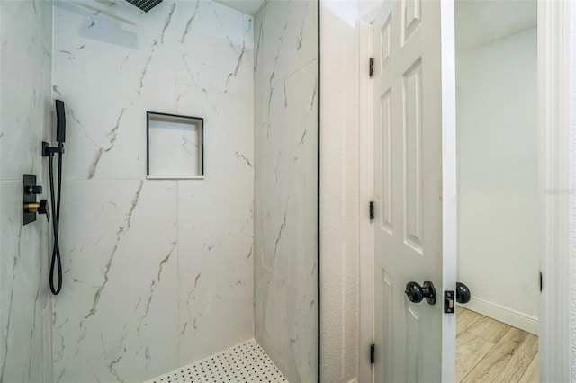 4212 Harry Dr, Fruitland Park, FL 34731 - bathroom featuring a marble finish shower and wood finished floors