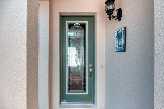 3432 Fallbrook Dr, Poinciana, FL 34759 - property entrance with stucco siding
