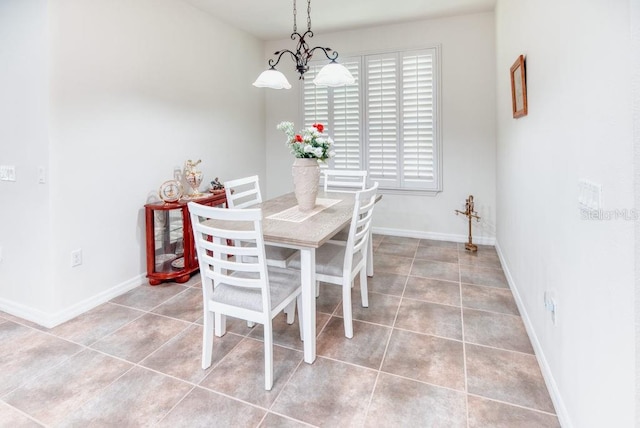 3432 Fallbrook Dr, Poinciana, FL 34759 - dining room featuring light tile patterned floors and baseboards