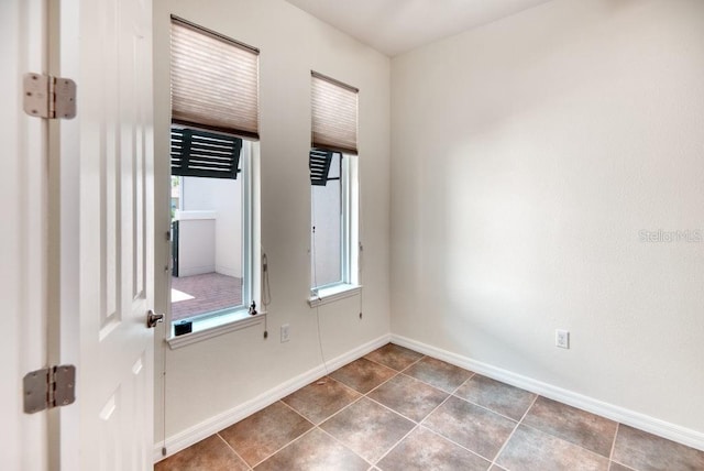 3432 Fallbrook Dr, Poinciana, FL 34759 - spare room with tile patterned floors and baseboards