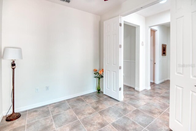 3432 Fallbrook Dr, Poinciana, FL 34759 - empty room with light tile patterned floors and a ceiling fan