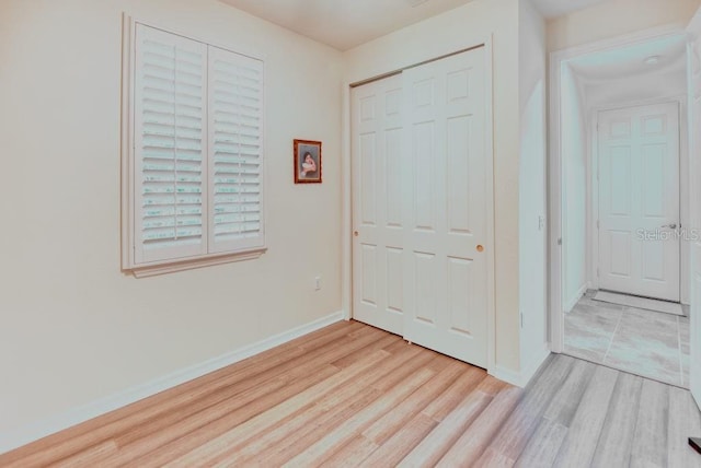 3432 Fallbrook Dr, Poinciana, FL 34759 - unfurnished bedroom featuring wood finished floors and a closet