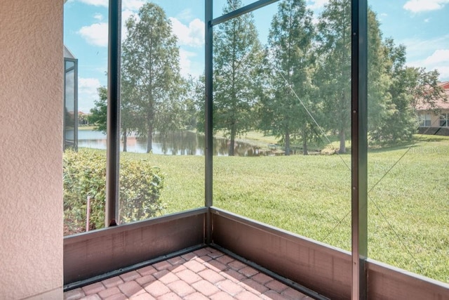 3432 Fallbrook Dr, Poinciana, FL 34759 - unfurnished sunroom with a water view and view of wooded area
