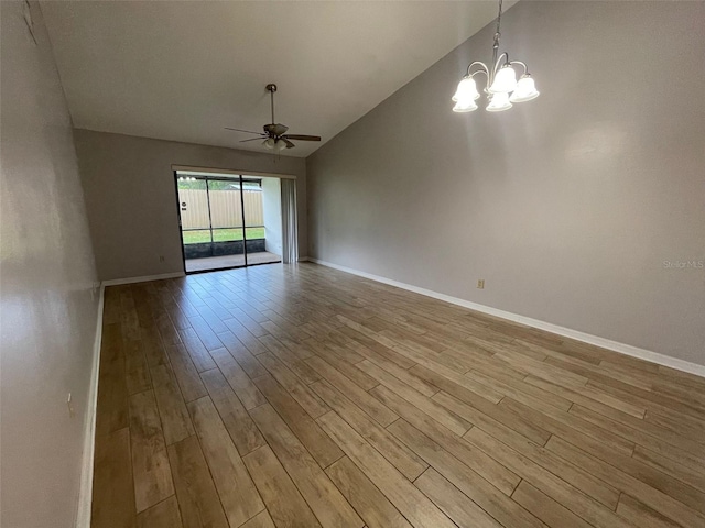 12161 Sandal Creek Way, Orlando, FL 32824 - unfurnished room featuring ceiling fan, wood finished floors, a chandelier, and high vaulted ceiling