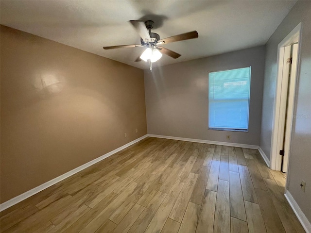 12161 Sandal Creek Way, Orlando, FL 32824 - empty room featuring a ceiling fan and wood finished floors