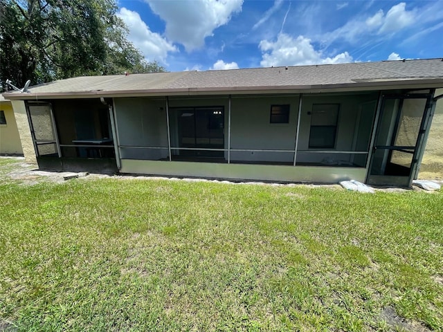 12161 Sandal Creek Way, Orlando, FL 32824 - back of property featuring a sunroom and a lawn