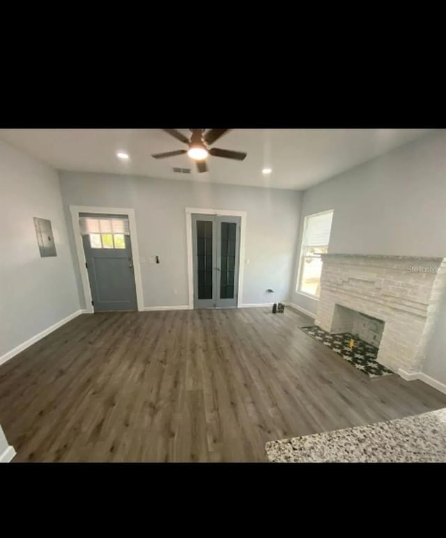 838 E Lime St, Lakeland, FL 33801 - unfurnished living room with a ceiling fan, wood finished floors, a brick fireplace, and recessed lighting