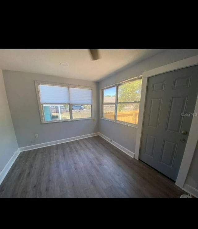 838 E Lime St, Lakeland, FL 33801 - foyer entrance with wood finished floors and baseboards
