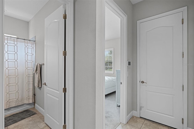 2419 Datura Loop, Saint Cloud, FL 34772 - hallway with light tile patterned floors and baseboards