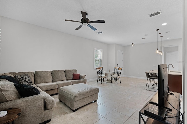 2419 Datura Loop, Saint Cloud, FL 34772 - living area featuring ceiling fan, light tile patterned floors, and recessed lighting
