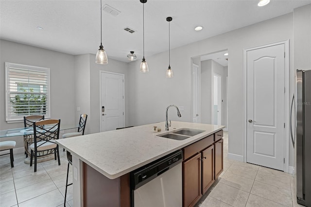 2419 Datura Loop, Saint Cloud, FL 34772 - kitchen featuring appliances with stainless steel finishes, light tile patterned floors, hanging light fixtures, a kitchen island with sink, and recessed lighting